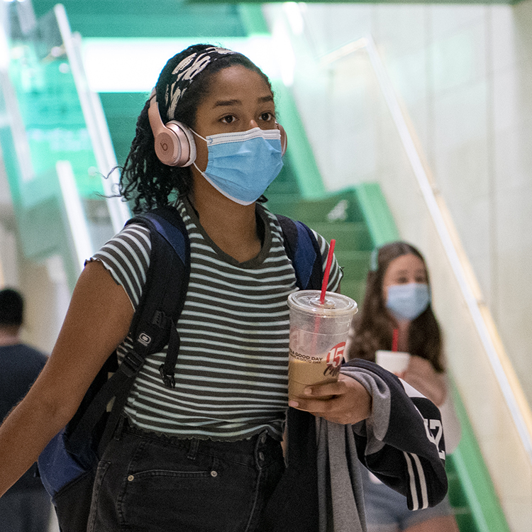 UNT student wearing a mask on campus