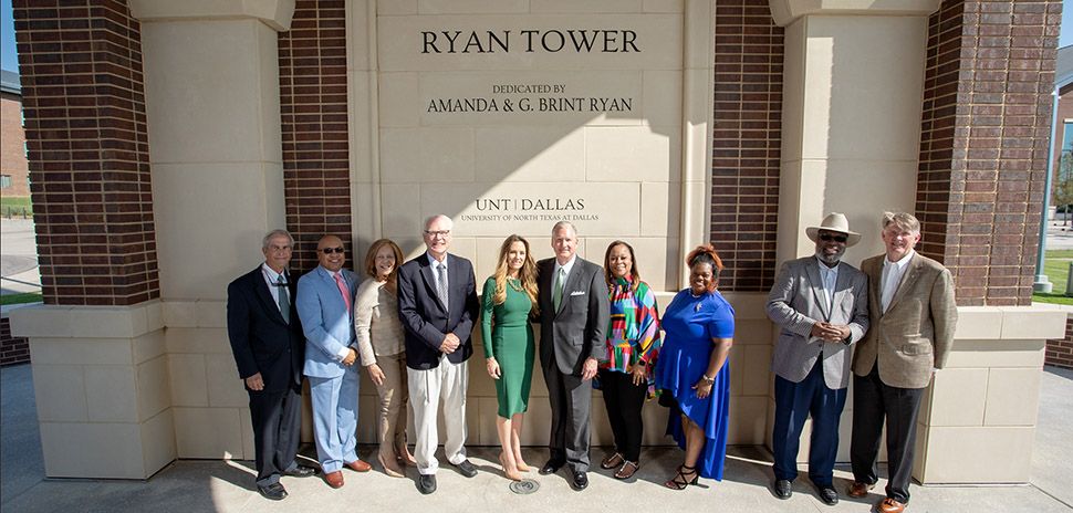 the-ryans-are-joined-by-dignitaries-at-the-base-of-their-namesake-ryan-tower-at-the-unt-dallas-ribbon-cutting