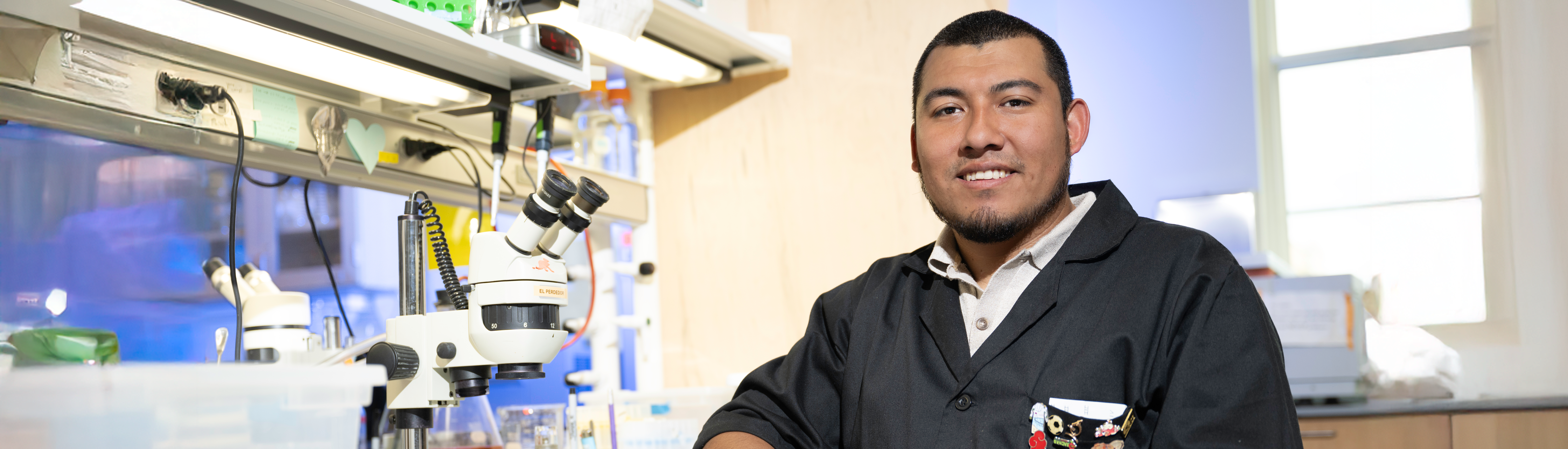 Top photo banner of UNT's Jose Robledo in one of the lab's in the College of Science