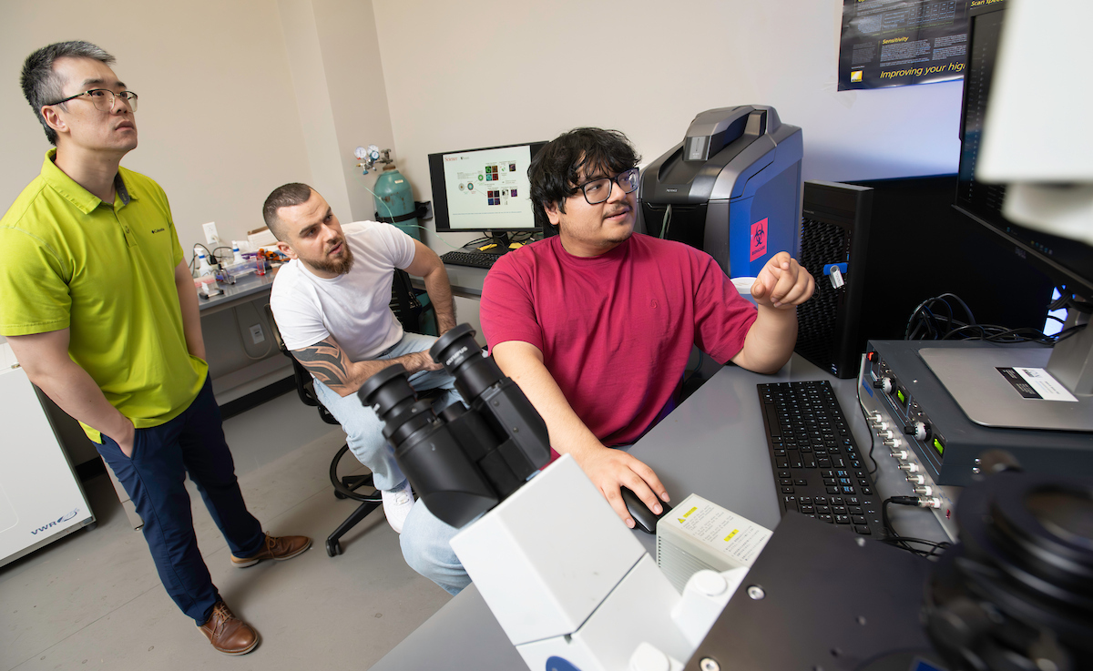 A photo of UNT's Adam Yang with Ph.D. students Marcel El-Mokahal and Angello H. Gomez
