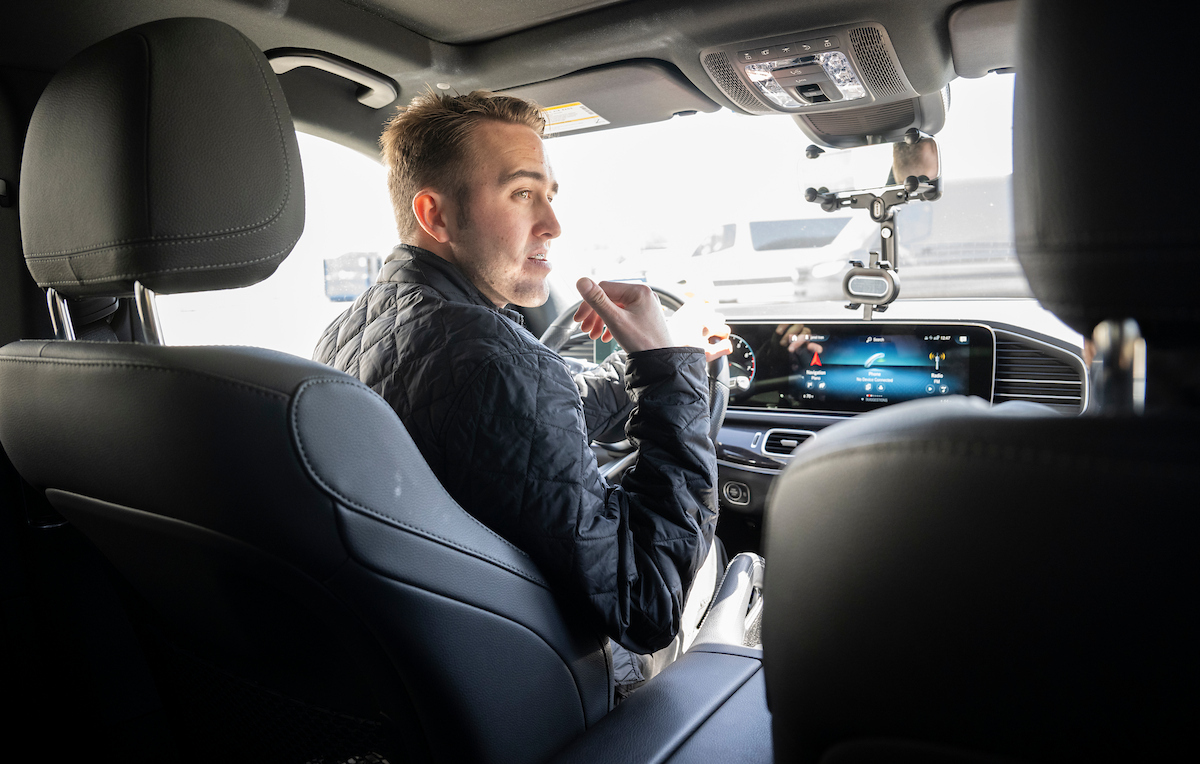 Photo of UNT's John Martin sitting in the front seat of a car