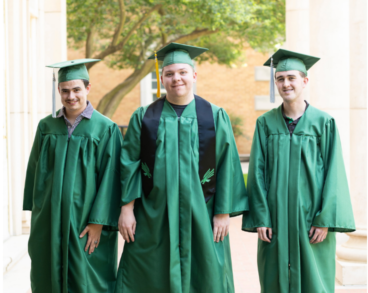 Full photo (left to right): UNT's ELEVAR students Noah Rahn, Alex Bartolo, and John Martin each wearing their green graduation cap and gown standing outside