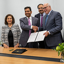 Satish and Yasmin Gupta with UNT President Neal Smatresk