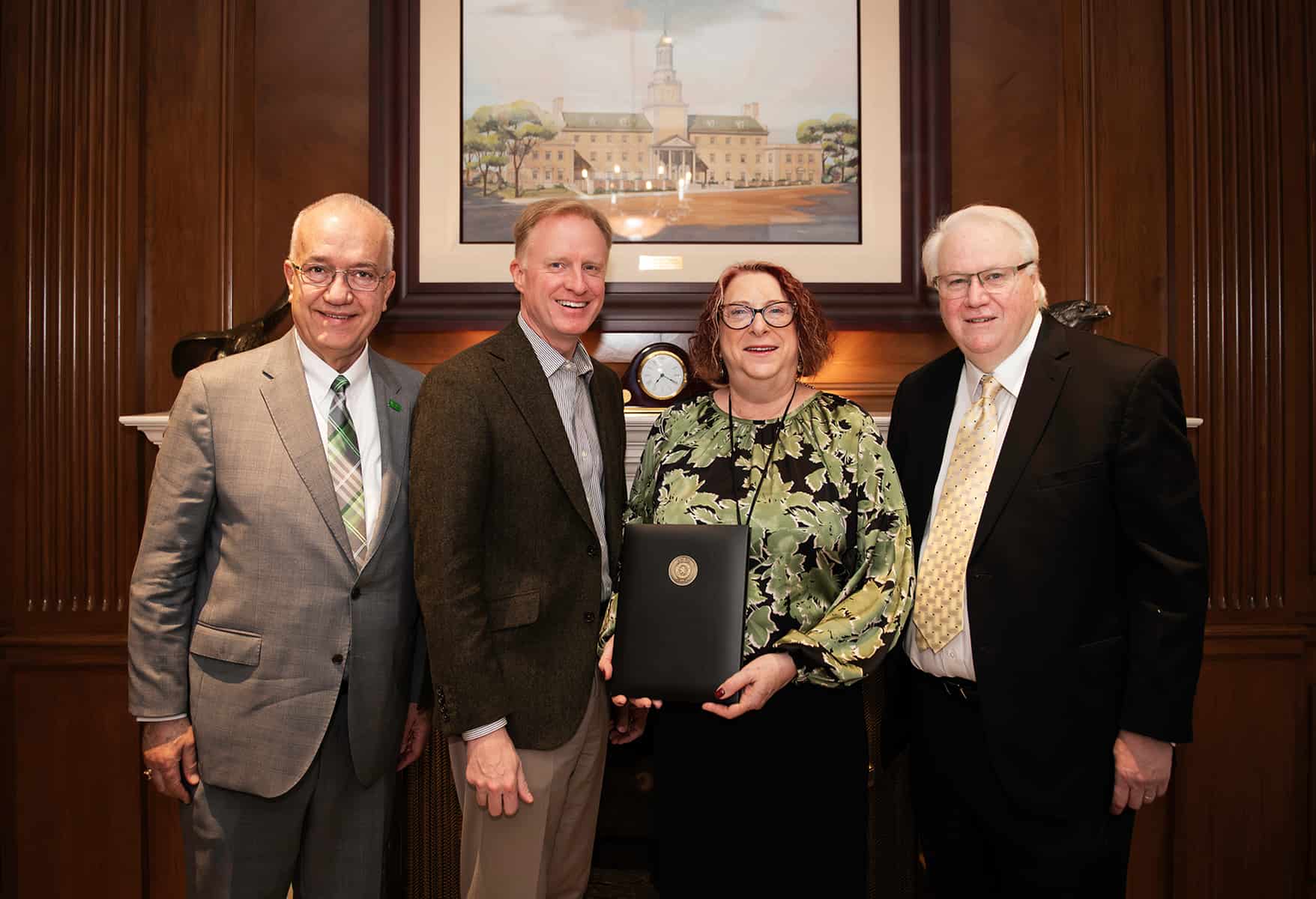 Full photo showing from left: UNT College of Music Dean John Richmond, UNT President Harrison Keller, Kathryn Kuddes, and Kent Kuddes 