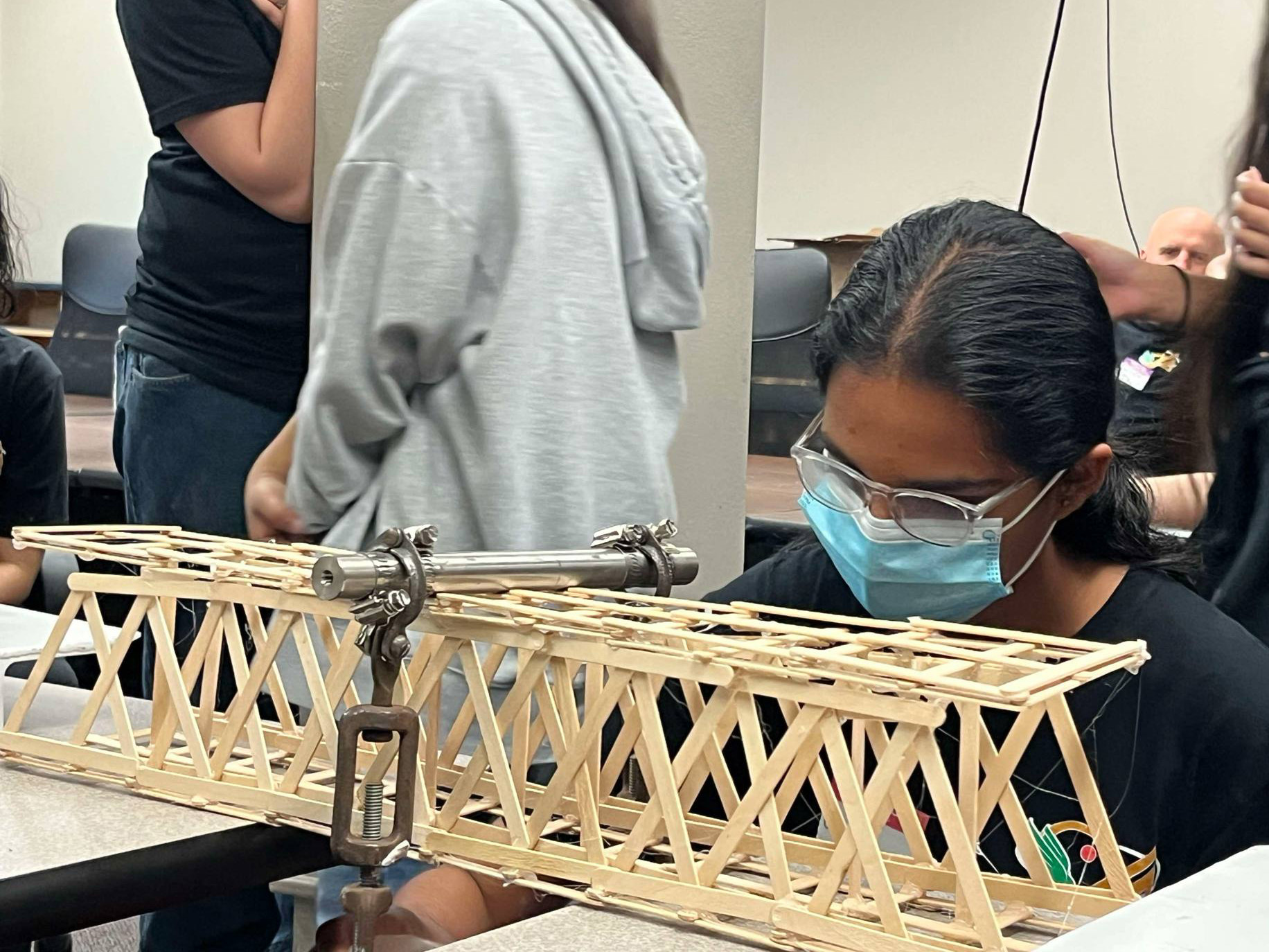 Photo of students tested bridges made of popsicles sticks at UNT