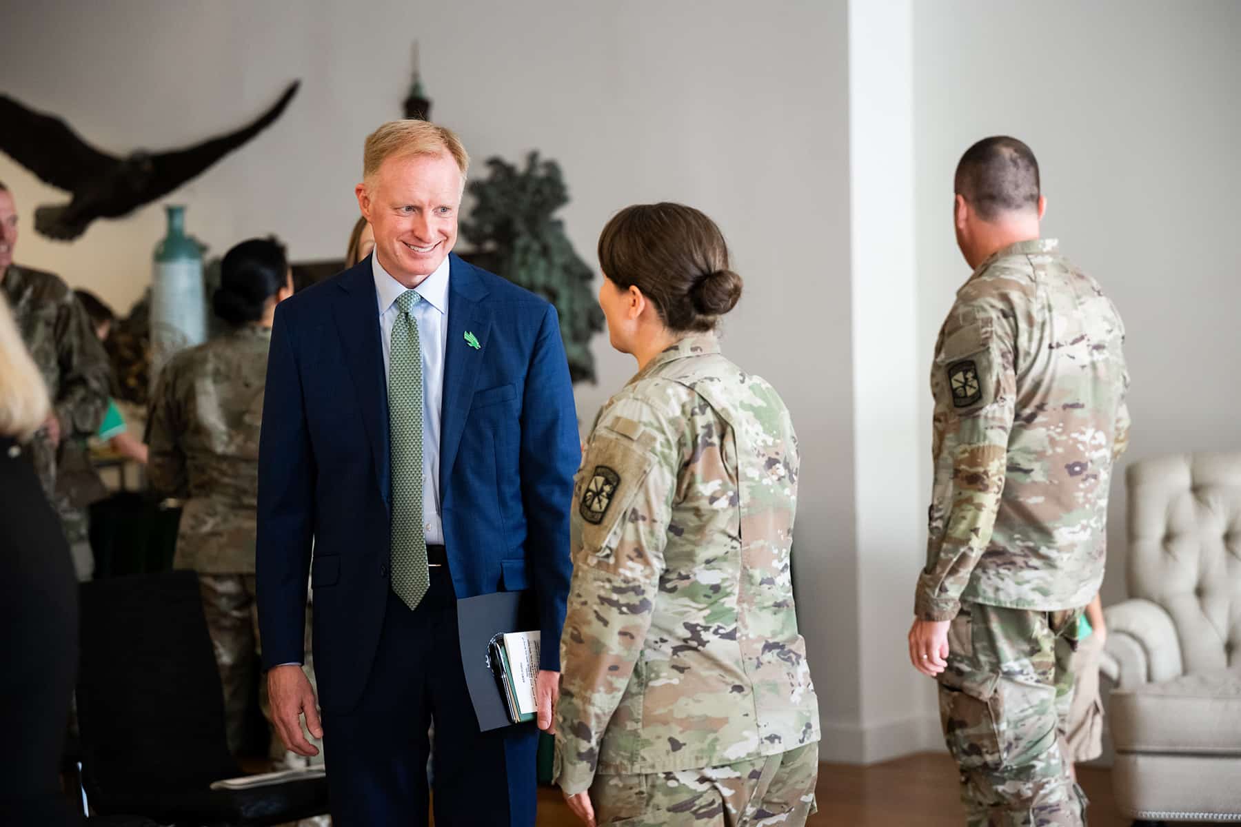 Photo of UNT President Harrison Keller, Ph.D., speaks with a member of the UNT Army ROTC battalion
