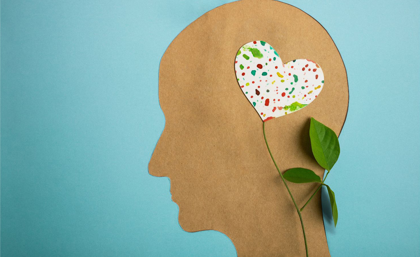 Stock photo of head silhouette with heart and leaves inside