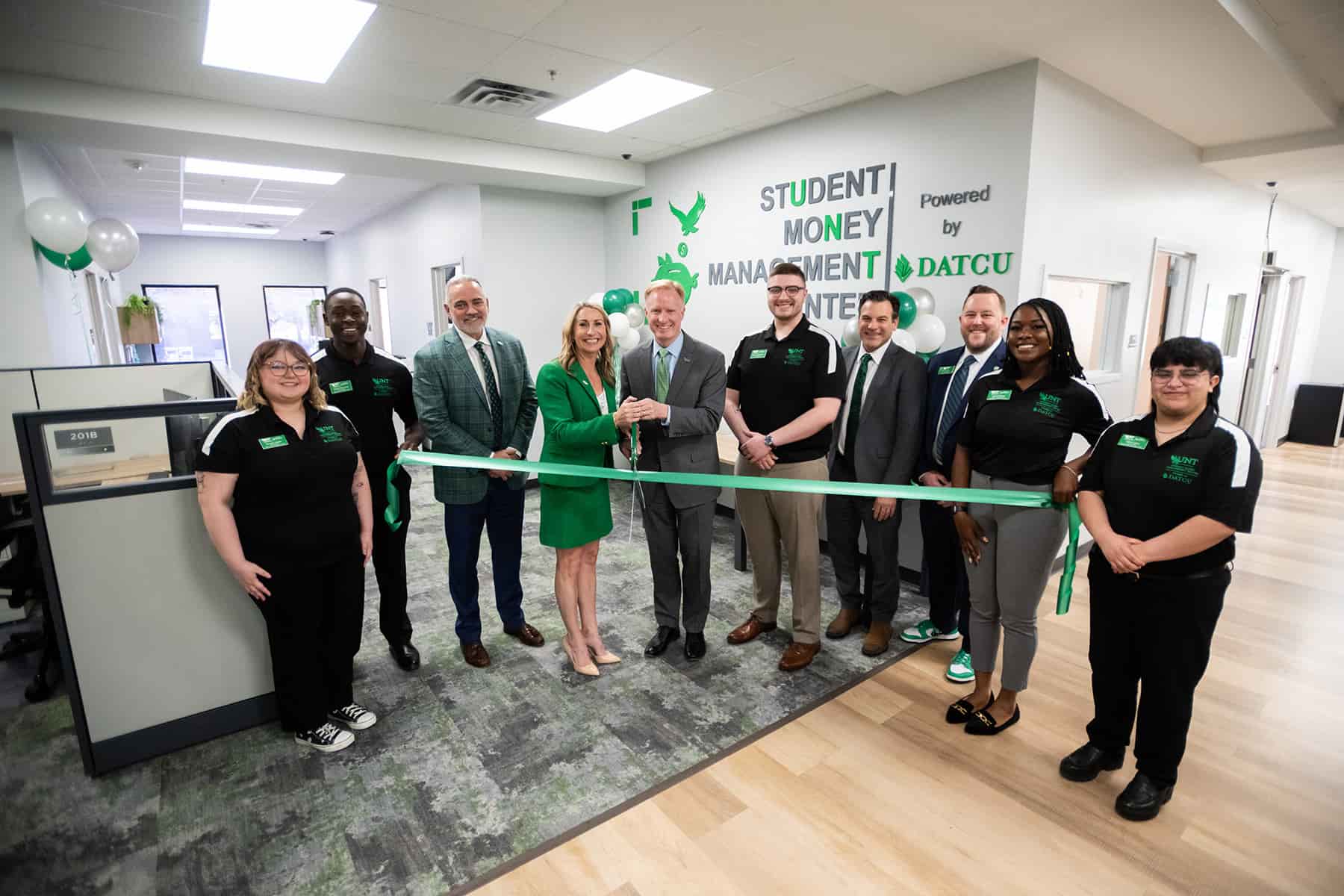 Full photo of the UNT ribbon cutting for the Student Money Management Center, powered by DATCU