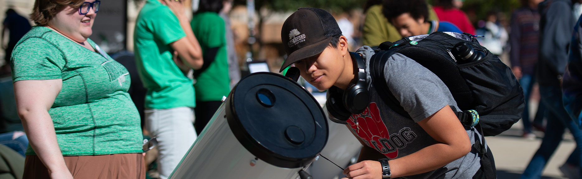 UNT Student at telescope