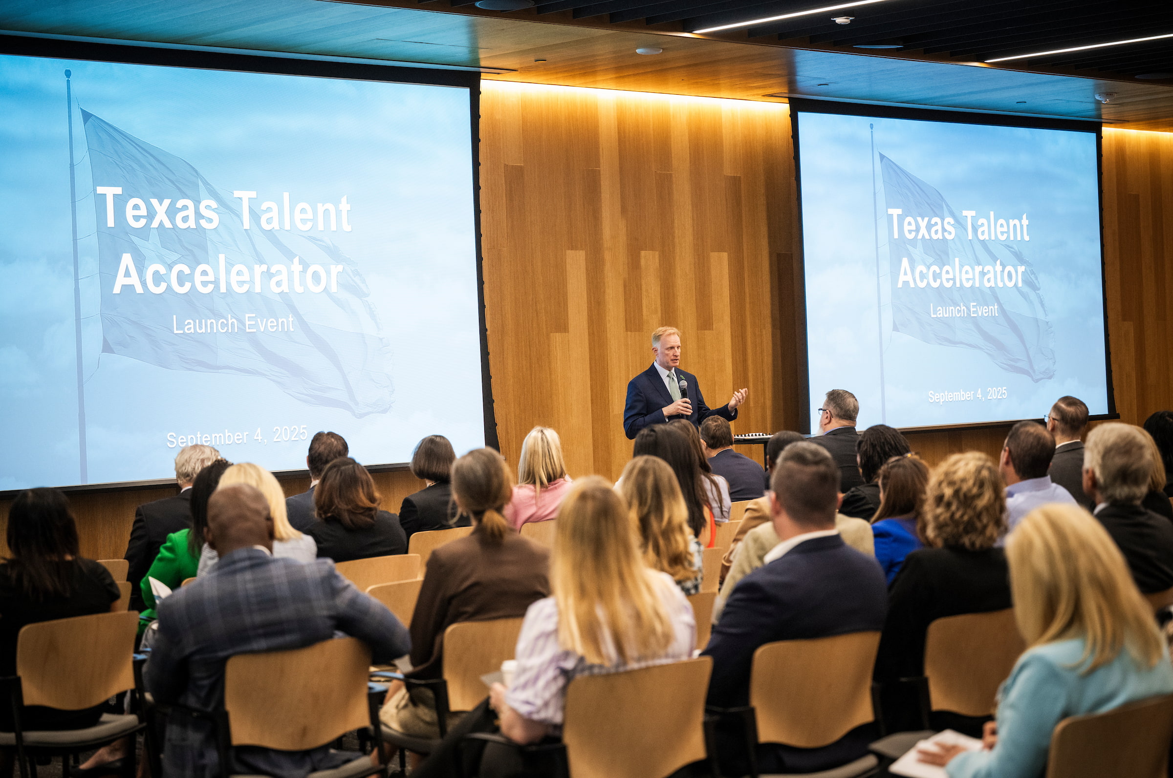 UNT president Harrison Keller, addresses an audience at the recent "Texas Talent Accelerator" A photo of UNT president Harrison Keller, addresses an audience in the center of a room at. He is flanked by two screens that say "Texas Talent Accelerator"