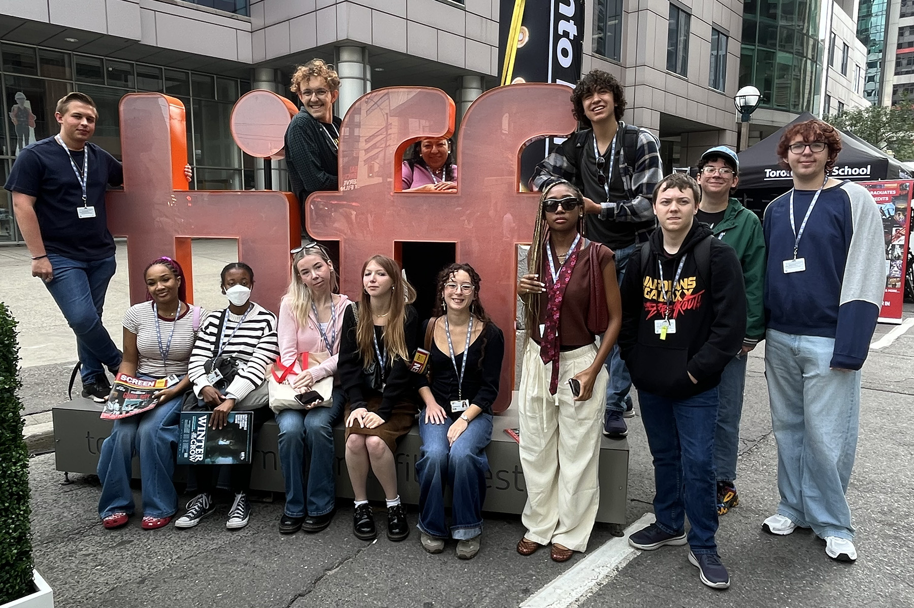 UNT students posing outside around the 2025 Toronto International Film Festival logo