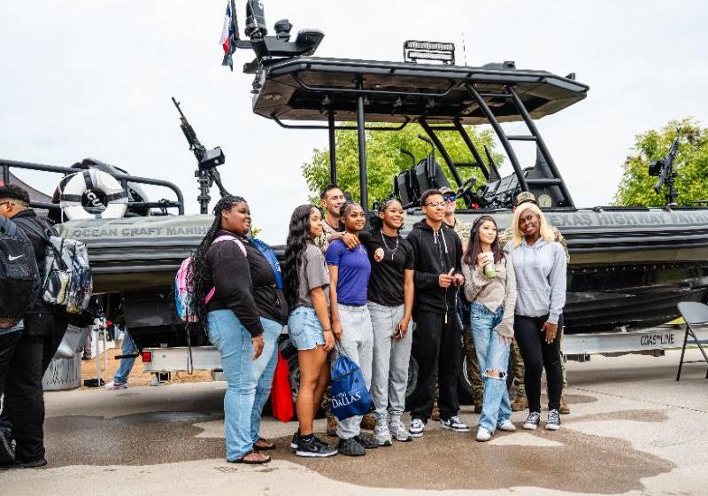 Students standing in front of a Texas Parks and Wildlife Dept. boat Photo of students standing in front of a Texas Parks and Wildlife Dept. boat