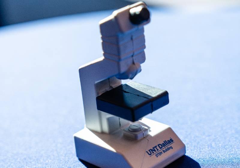 A photo of a UNT Dallas microscope marks a milestone: Seeing something small may lead to big ideas