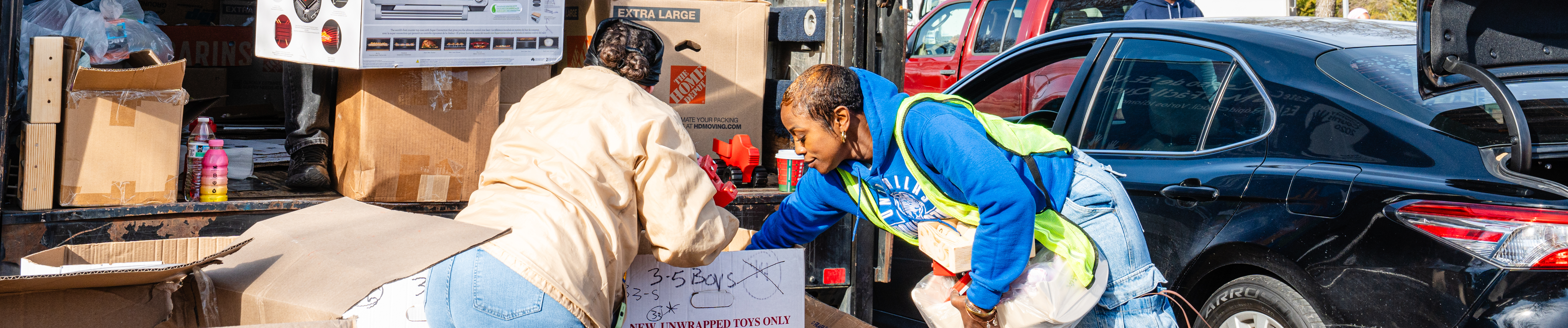 Top banner photo of UNT Dallas faculty, staff and students volunteer during monthly food distribution 