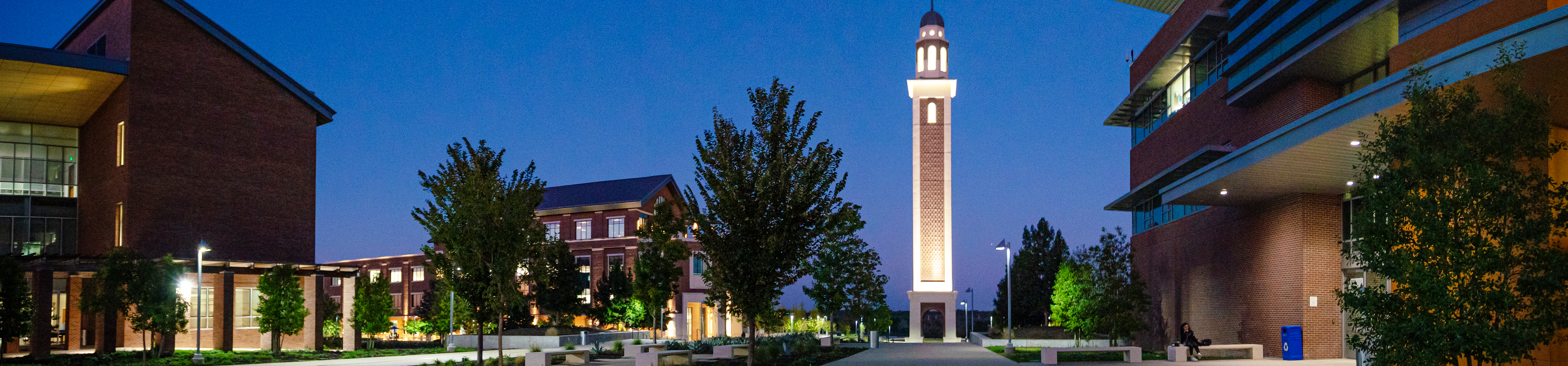 Photo of UNT Dallas campus and the Ryan Tower at night