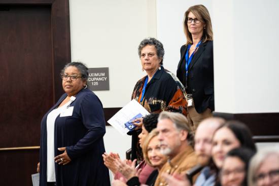 Professor Wattley watches as UNT Dallas College of Law graduates