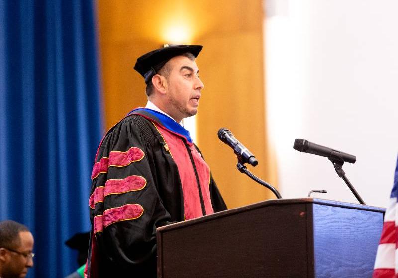 Photo of a UNT Dallas's Dr. Shaqliah Speaks at a Graduate School Hooding Ceremony