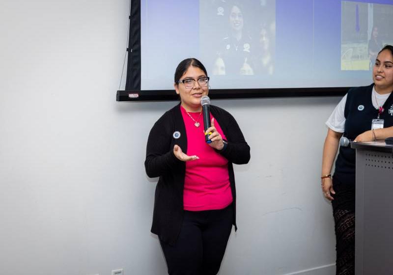 UNT Dallas's Julisa Morones at the Dallas City Hall Photo of UNT Dallas's Julisa Morones standing next to a podium at the Dallas City Hall