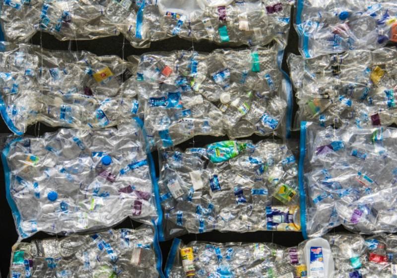 Photo of plastic waste packed and stacked; an estimated 20 million tons gets added to the environment annually. Photo courtesy: Nick Fawling 