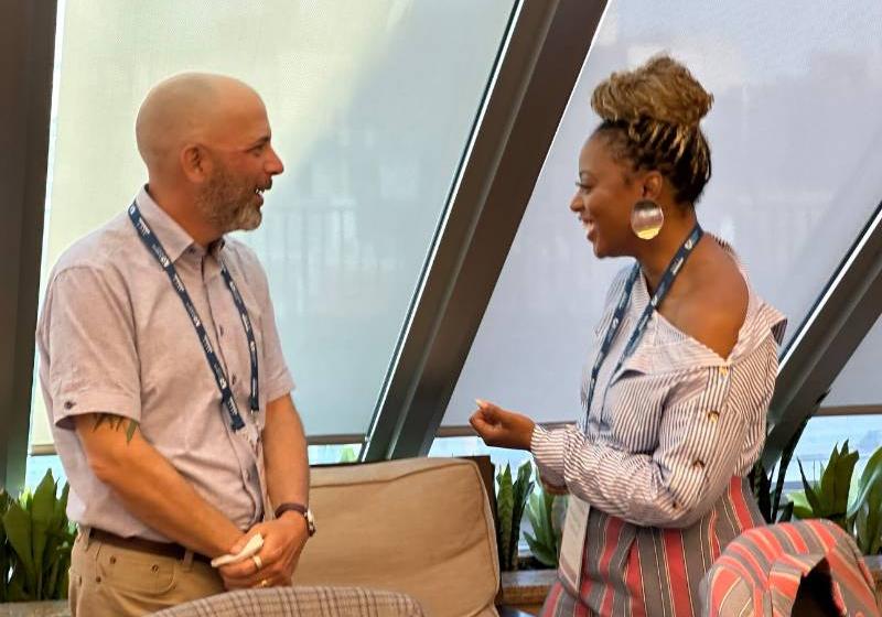 Photo of UNT Dallas's Dr. Kimberly Riddick engages with AASCU Emerging Leaders Program Colleague 