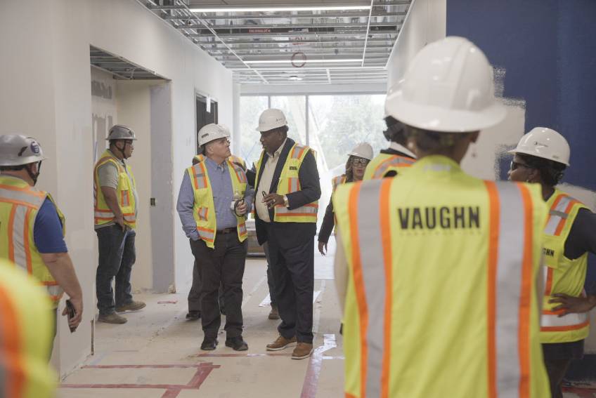 Photo of President Warren von Eschenbach and State Sen. Royce West discuss amenities of the new UNT Dallas STEM building during a tour of the construction 