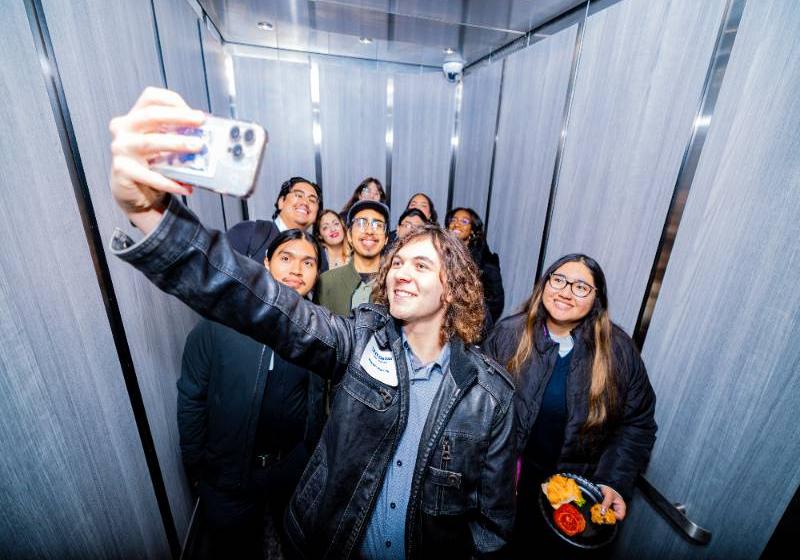 Photo of UNT Dallas students take a selfie in elevator of the New STEM building
