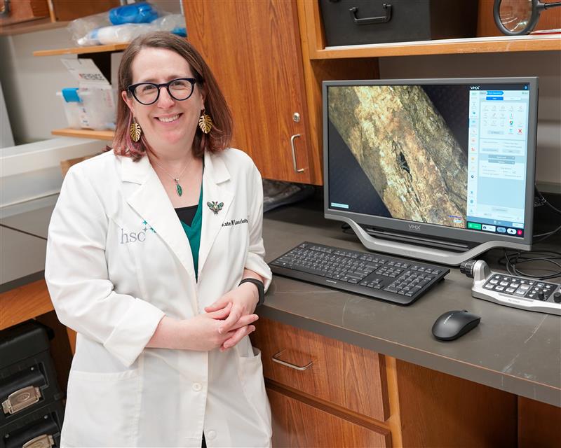 Photo of UNT Health's Dr. Kate Lesciotto in her lab by a monitor