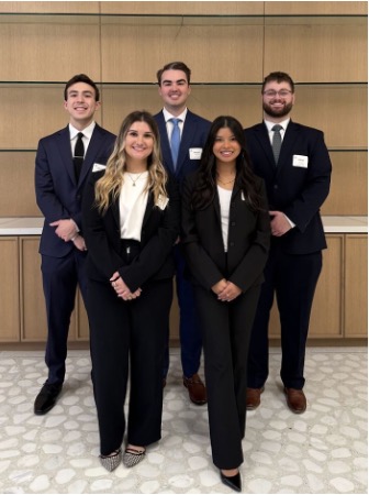 UNT Health's 5 College of Public Health students, from the Master of Health Administration first place winning team. Photo of UNT Health's 5 happy College of Public Health students, from the Master of Health Administration first place winning team, each dressed in dark suit jacket and pants posing for their photograph. The back row consists of 3 men. The front row shows 2 woman.