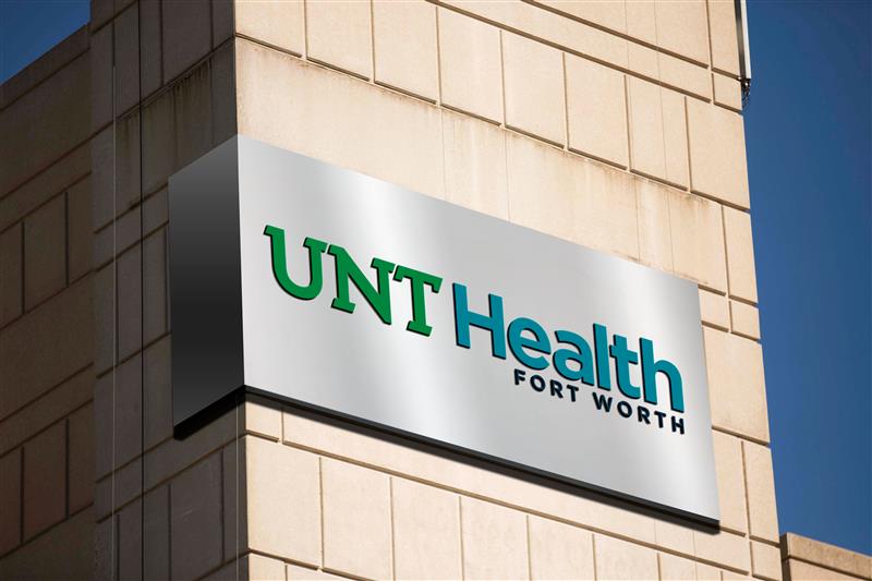 A photograph mock up sign of the top corner of the UNT Health's new logo lettering.