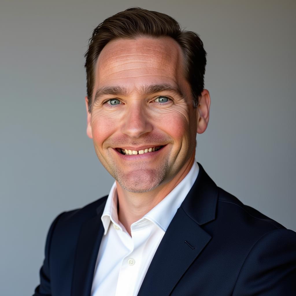 Photo portrait of UNT Health's of Brian Pfahning posing in front of a gray backdrop
