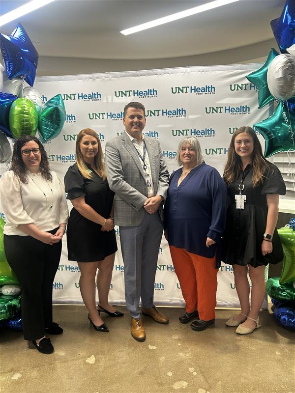 Celebrating UNT Health's Fort Worth Speech & Hearing Center grand opening Photo of 5 people pose during the grand opening of the UNT Health Fort Worth Speech & Hearing Center