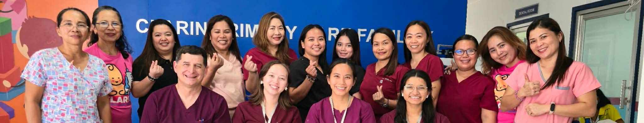 Top horizontal narrow cropped photo banner of UNT Health TCOM students and faculty, including Dr. Thomas Shima, pose with local medical staff at the Clarin Primary Care Facility in Bohol, Philippines, during a January medical outreach mission. 