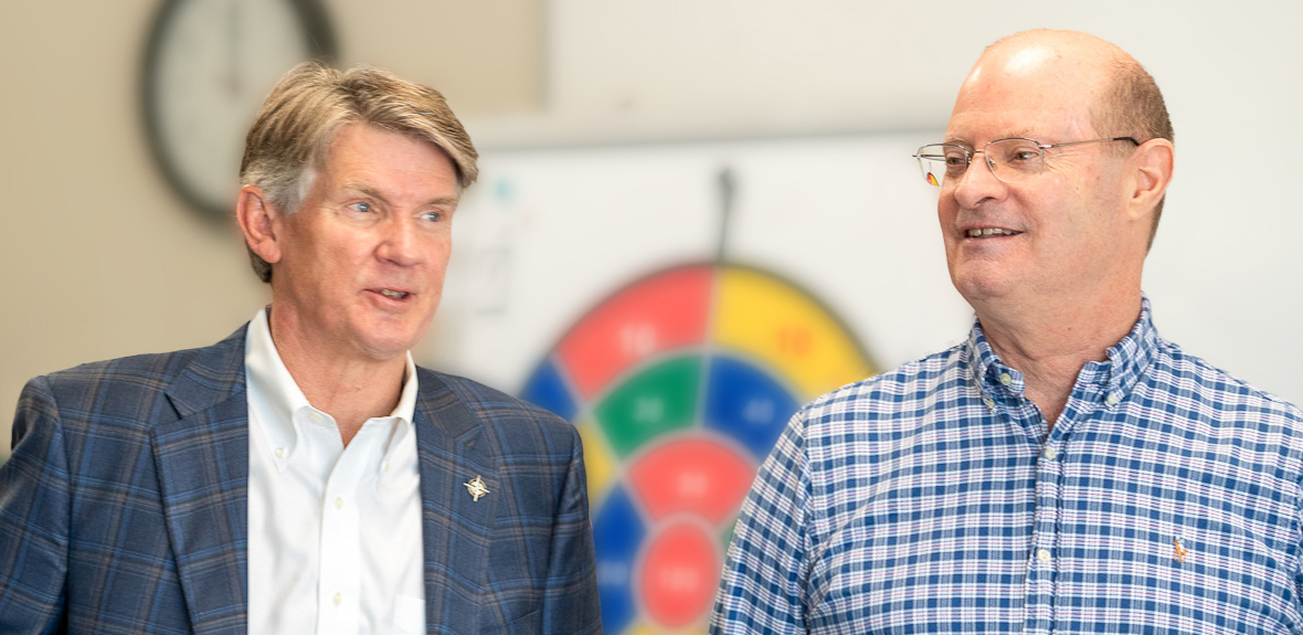 Chancellor Dr. Michael R. Williams (left) and Greg Anderson