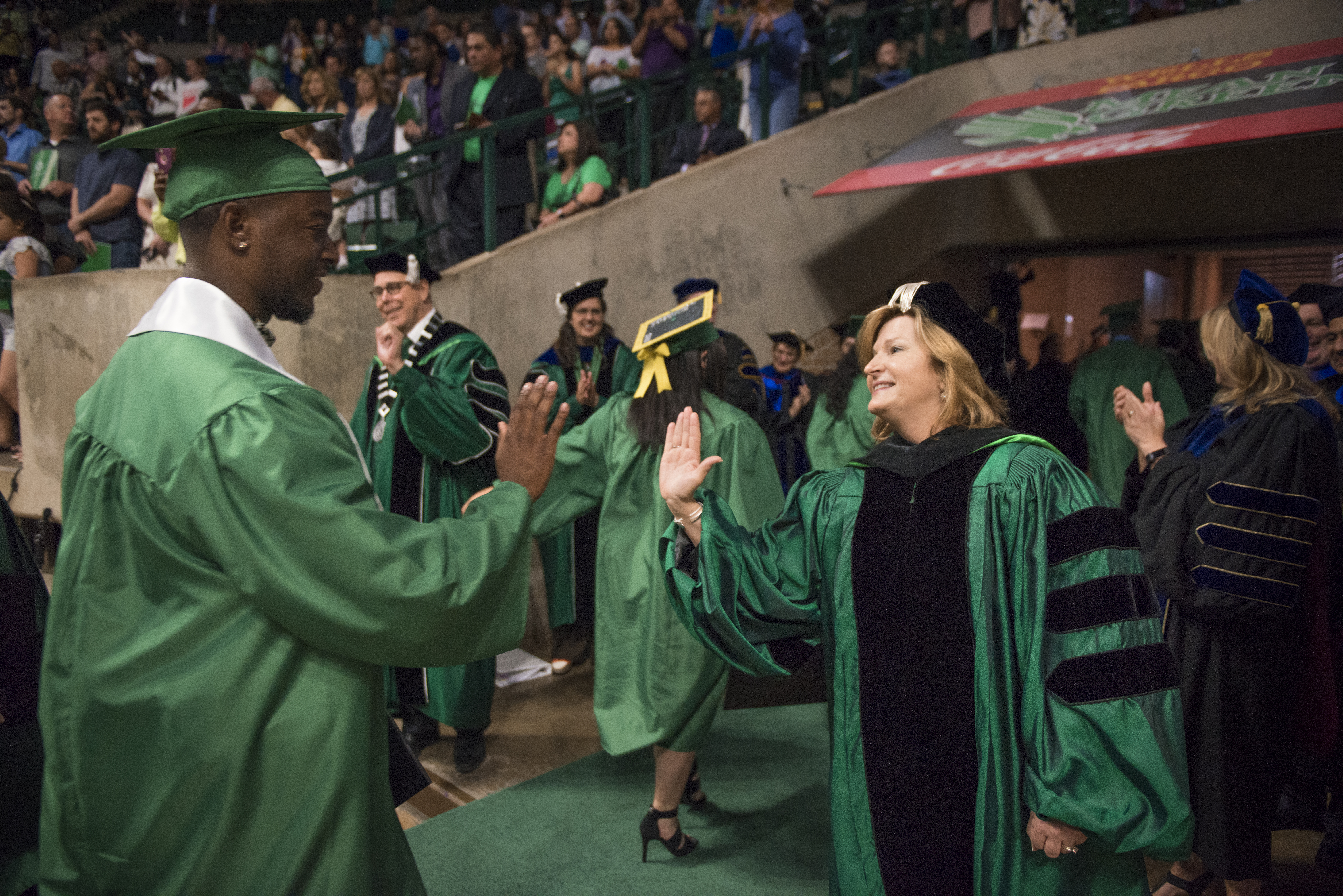 Chancellor Lesa Roe congratulates a University of North Texas graduate Chancellor Lesa Roe congratulates a University of North Texas graduate